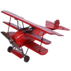 Avión tri-plano rojo
